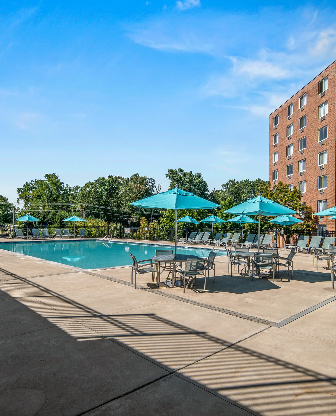 Pool deck with seatings and umbrellas